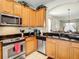This modern kitchen features stainless steel appliances and sleek granite countertops at 2548 Archfeld Blvd, Kissimmee, FL 34747