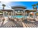 Inviting pool with shade, lounge chairs and views of the community at 2548 Archfeld Blvd, Kissimmee, FL 34747