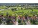 Aerial view showcasing a sprawling golf course and the home's prime location at 2630 Albion Ave, Orlando, FL 32833