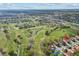 Panoramic aerial view of a residential neighborhood nestled within a lush golf course community at 2630 Albion Ave, Orlando, FL 32833