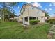 Expansive backyard with mature landscaping and charming screened in patio at 2630 Albion Ave, Orlando, FL 32833