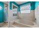 Bright bathroom with a garden tub, separate shower, and tile surround at 2630 Albion Ave, Orlando, FL 32833