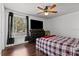 Bright bedroom with dark wood floors and a ceiling fan at 2630 Albion Ave, Orlando, FL 32833