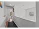 Upstairs hallway with neutral colors and natural light at 2630 Albion Ave, Orlando, FL 32833