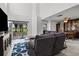 Open-concept living area with dining space, tile flooring, and great natural light at 2630 Albion Ave, Orlando, FL 32833