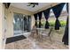 Inviting tiled porch with comfortable seating, ceiling fan, and scenic views at 2630 Albion Ave, Orlando, FL 32833