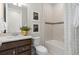 Cozy bathroom with a combination tub and shower and decorative accent tiles at 2725 Serenity Garden Dr, Kissimmee, FL 34744