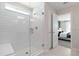 Modern bathroom featuring a glass enclosed shower with bench and subway tile at 2725 Serenity Garden Dr, Kissimmee, FL 34744
