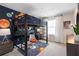Fun room with space themed decor and an innovative loft bed with desk at 2725 Serenity Garden Dr, Kissimmee, FL 34744