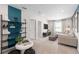 Cozy upstairs loft with modern furnishings, a TV, and natural light from the window at 2725 Serenity Garden Dr, Kissimmee, FL 34744