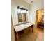 Bathroom featuring granite countertops, vanity with mirror, and modern light fixtures at 2822 Bella Vista Dr, Davenport, FL 33897