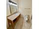 Bathroom with vanity, decorative mirror, light fixture, toilet, and tile floor at 2822 Bella Vista Dr, Davenport, FL 33897