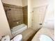 Bathroom including a tiled shower/tub, sink, and toilet at 2822 Bella Vista Dr, Davenport, FL 33897