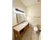 Bathroom with vanity, granite countertop, mirror, and toilet at 2822 Bella Vista Dr, Davenport, FL 33897