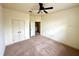 Spacious bedroom featuring a ceiling fan and plush carpet at 2822 Bella Vista Dr, Davenport, FL 33897
