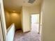 Hallway with carpeted floor and door to bedroom at 2822 Bella Vista Dr, Davenport, FL 33897