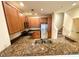 Charming kitchen featuring granite countertops, stainless steel appliances and wooden cabinetry at 2822 Bella Vista Dr, Davenport, FL 33897