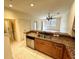 Well-lit kitchen boasts stainless steel appliances, granite countertops, and stylish cabinetry at 2822 Bella Vista Dr, Davenport, FL 33897