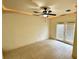 Spacious living room with tile flooring, ceiling fan, and glass patio doors at 2822 Bella Vista Dr, Davenport, FL 33897