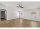 Spacious bedroom featuring wood floors, natural lighting, and ample closet space at 2930 Paddington Way, Kissimmee, FL 34747