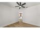 Bright bedroom featuring hardwood floors, ceiling fan, and closet at 2930 Paddington Way, Kissimmee, FL 34747