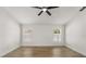 Bright bedroom featuring wood floors and natural lighting at 2930 Paddington Way, Kissimmee, FL 34747