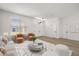 A sun-filled living room area features a modern design with stylish furniture at 2930 Paddington Way, Kissimmee, FL 34747