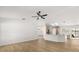 Spacious living room featuring an open-concept design with wood floors and natural lighting at 2930 Paddington Way, Kissimmee, FL 34747