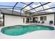 A beautiful screened-in pool offers the perfect place to relax and entertain at 2930 Paddington Way, Kissimmee, FL 34747
