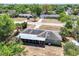 Birds-eye view of home showing the surrounding neighborhood and mature trees at 295 W Charlotte Ave, Eustis, FL 32726