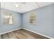 Serene bedroom with hardwood floors, a ceiling fan and lots of natural light at 295 W Charlotte Ave, Eustis, FL 32726