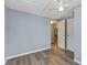 Cozy bedroom with hardwood floors, a ceiling fan and a closet at 295 W Charlotte Ave, Eustis, FL 32726