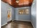 Bright dining room with wood ceiling and view to the kitchen at 295 W Charlotte Ave, Eustis, FL 32726