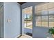 A view from the front door to the exterior, highlighting the home's light and airy entryway at 295 W Charlotte Ave, Eustis, FL 32726