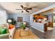 Cozy living room with a comfortable sofa, stylish decor, and open view to the kitchen at 295 W Charlotte Ave, Eustis, FL 32726
