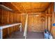Inside the shed, a workbench and shelves provide ample space for projects and storage at 295 W Charlotte Ave, Eustis, FL 32726
