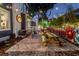 Outdoor patio featuring brick pavers, picnic tables, and a vibrant mural, great for entertaining at 301 S Palmetto Ave, Sanford, FL 32771