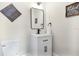 Charming half bathroom featuring modern fixtures and decor accents at 301 S Palmetto Ave, Sanford, FL 32771