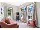 A TV is mounted over an arcade game in this colorful recreation room at 301 S Palmetto Ave, Sanford, FL 32771