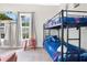 A colorful room with a bunk bed, TV and a playful theme at 301 S Palmetto Ave, Sanford, FL 32771