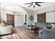 Elegant living room featuring wood floors, comfortable seating, and stylish sliding barn doors at 301 S Palmetto Ave, Sanford, FL 32771