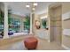 Charming bathroom with tile floors, tub, and sink with white cabinets at 3156 Winding Pine Trl, Longwood, FL 32779
