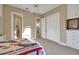 Inviting bedroom with neutral walls and carpet, featuring a ceiling fan and built-in closets for ample storage at 3156 Winding Pine Trl, Longwood, FL 32779