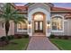 Charming front entrance with a decorative door, well-manicured landscaping, and inviting curb appeal at 3156 Winding Pine Trl, Longwood, FL 32779