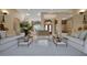Spacious living room featuring neutral tones, elegant furnishings, and an abundance of natural light at 3156 Winding Pine Trl, Longwood, FL 32779
