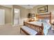 This main bedroom features a wooden bed frame and carpeted floors at 3156 Winding Pine Trl, Longwood, FL 32779