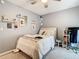 Bedroom with light-colored walls, a ceiling fan, and decorative wall shelves at 3408 Idlegrove Ct, Orlando, FL 32822