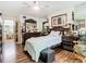 Bedroom featuring a ceiling fan and an entry to a room with a table and chairs at 3408 Idlegrove Ct, Orlando, FL 32822