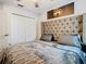 Bedroom featuring an upholstered headboard, ceiling fan, and closet at 3408 Idlegrove Ct, Orlando, FL 32822