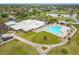An aerial view of the clubhouse, swimming pool and putting green showcasing community amenities at 3408 Idlegrove Ct, Orlando, FL 32822
